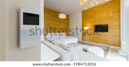 smart screen with smart home apps on wall in modern apartment