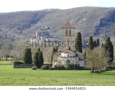 Medieval Basilica Saint-Just de Valcabrère in Comminges, Haute-Garonne, Occitanie, southern France in the foothills of the Pyrenees. Saint-Bertrand-de-Comminges Cathedral in the background