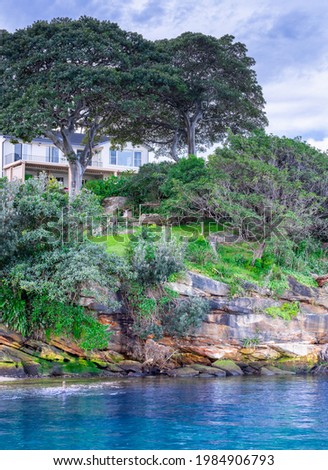 View of residential house on Sydney harbour foreshore NSW Australia 