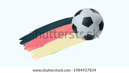 Composition of football with german flag isolated on white background. sports and competition concept digitally generated image.