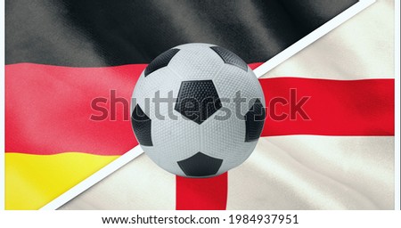Composition of football over german and english flag background. sports and competition concept digitally generated image.