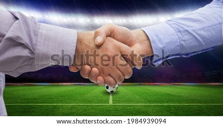 Composition of business people shaking hands over sports stadium. sports, deal, agreement and competition concept digitally generated image.