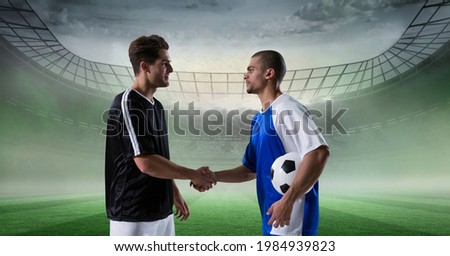 Composition of football captains shaking hands over sports stadium. sports, greeting, agreement and competition concept digitally generated image.