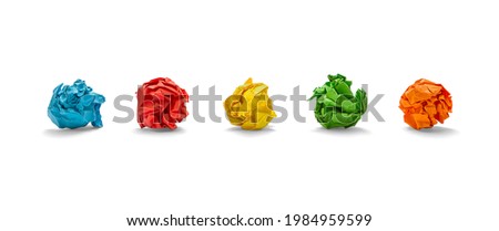 Colorful crumpled sheets of paper on white background