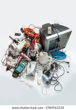 Heap
 of electronic waste for recycling. Old household electrical appliances. Sustainable living concept Royalty-Free Stock Photo #1984963226