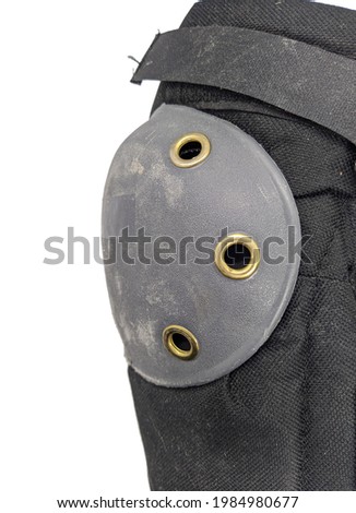 one old and shabby knee pad on a white background.
