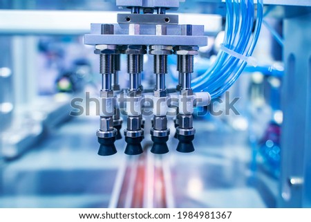 robotic pneumatic piston sucker unit on industrial machine,automation compressed air factory production Royalty-Free Stock Photo #1984981367