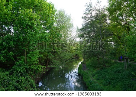 River Wuhle and surroundings with magnificent vegetation in May. Berlin, Germany