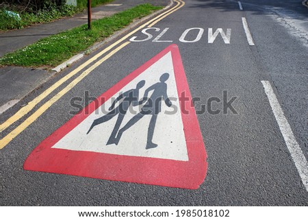 Warning sign on roadway at children school crossing