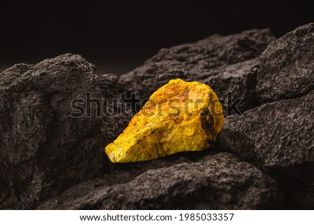 uranium ore in mine, mineral radiation concept, radioactive energy Royalty-Free Stock Photo #1985033357
