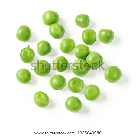 Green peas closeup isolated on white. Clipping path. Top view. Royalty-Free Stock Photo #1985049080
