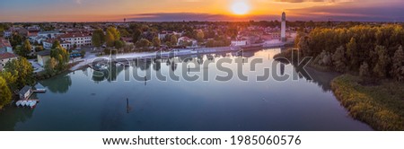 Aerial view shot by drone of the Casier harbour on the river Sile at sunset