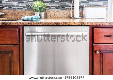 Blank stainless steel dishwasher in kitchen, clean and dirty dishes magnets mockup