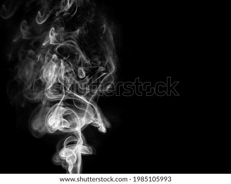 Abstract background in the form of white smoke on a black background 