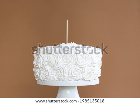 White cake with cake topper stick and blank brown background , on cake stand , Wooden cake topper mockup