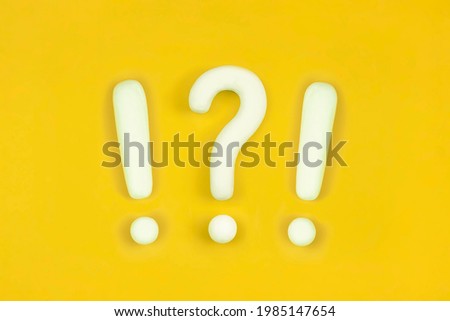 Strong emotions sign, strong emotional reaction. Interrobang, question mark and exclamation mark on orange background. Communication of Wtf, unbelievable, confusion concept. Royalty-Free Stock Photo #1985147654
