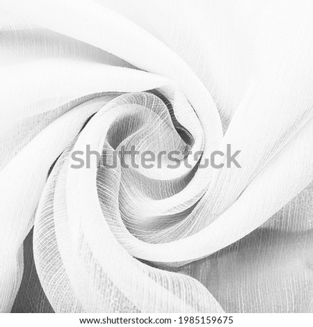 Cloth. Folds of fabric twisted in a circle. Background for design and presentation.