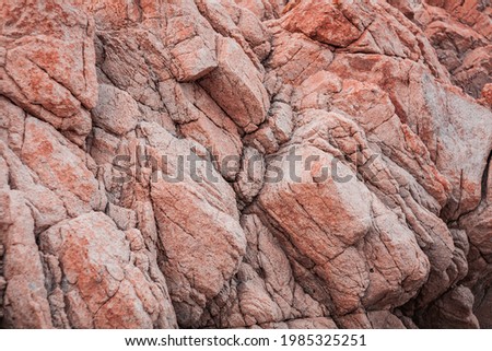 Red and pink rocks, wind erosion, geology stratification, air oxidation. Teal and orange lighting, endless horizon, and soft pastel-colored clouds.