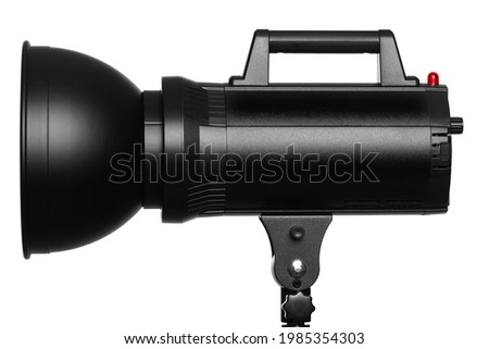 Studio flash with reflector on stand for photography in studio isolated on white background.