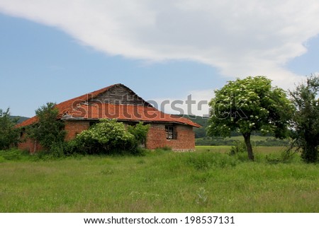 Old farm in the rural meadow
