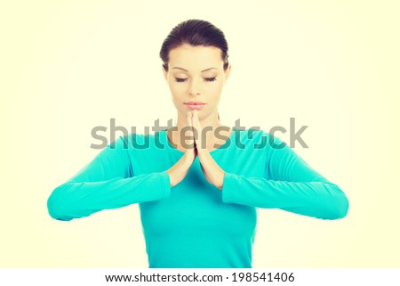 Beautiful woman in meditation. Casual clothes.