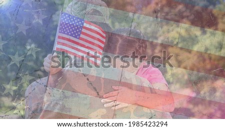 Composition of male soldier embracing daughter over american flag. soldier returning home to family concept digitally generated image.
