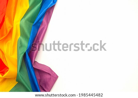 The rainbow flag (LGBT) isolated on a white background. Top view. Flat lay. Space for text. Love concept. Royalty-Free Stock Photo #1985445482
