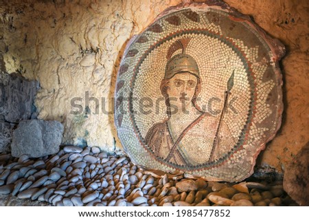 Ancient mosaic depicting a roman soldier, warrior face. Royalty-Free Stock Photo #1985477852