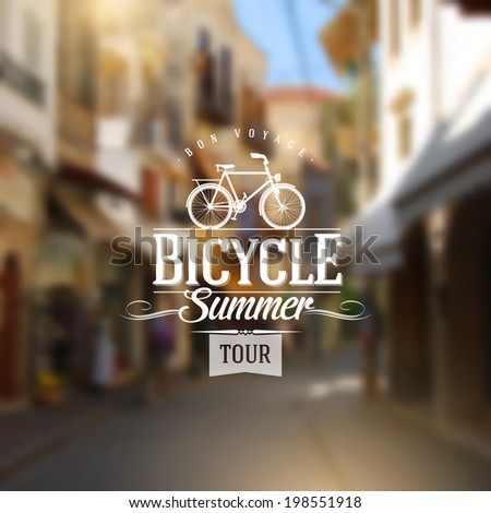 Type vintage design with bicycle silhouette against a old european street defocused background