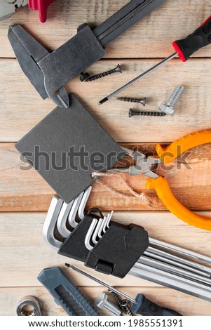 Set of work tools on a wooden background. Festive greeting card concept for Father's day