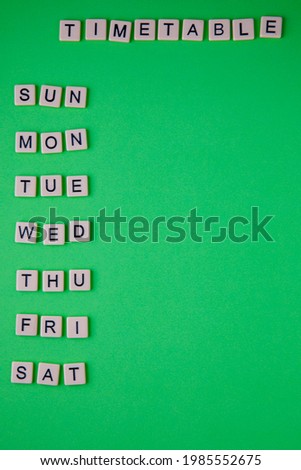 The creative weekly schedule for fun study, business or Hobbies. Days of the week on modern bright green paper background, plastic letters. Photo for blog, organizer, Vertical, copy space