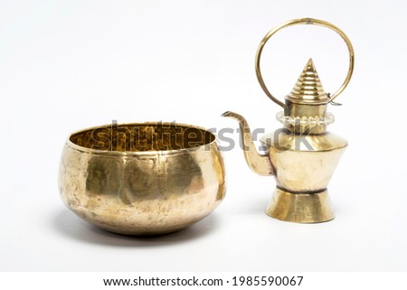 old brass kettle on white background