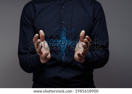 Businessman holds the AI. Сoncept of modern computer technologies, data mining. Hands touch the futuristic AI processor. Machine Deep Learninи