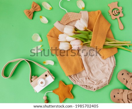 Set of baby items and accessories on green background. Baby blogger. shower concept. Fashion newborn. Flat lay, top view
