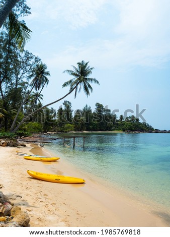 Yellow Kayak boat on tropical island beach white sand under bright sun in summer season. Koh Kood - Thailand