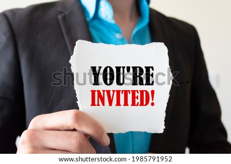 Businessman holding card with you're invited about invitation concept.