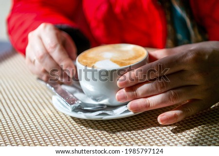 A simple image of a morning cup of coffee with cream. Good morning! 