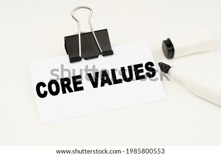 Finance and business concept. On a white background is a marker and a business card with the inscription - CORE VALUES