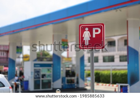 The pregnant parking sign at gas station or filling station.