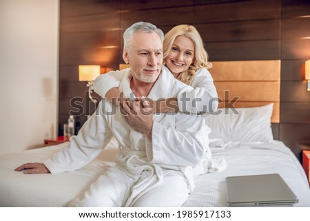 Couple in bath robes spending a day together and feeling relaxed