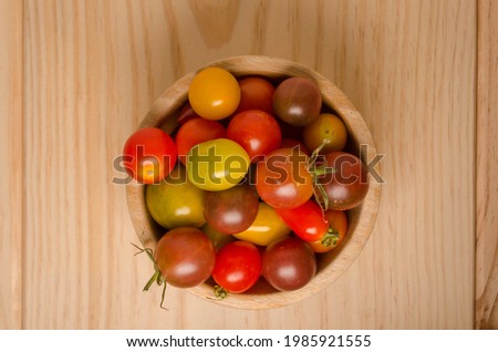 beautiful tomatoes on wooden background