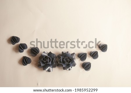 Designer cut paper 100 gram for make origami rose and leaves, handmaed  romantic bouquet for valentine, wedding, card, and decorate backdrop. Focus rose paper on the white background.