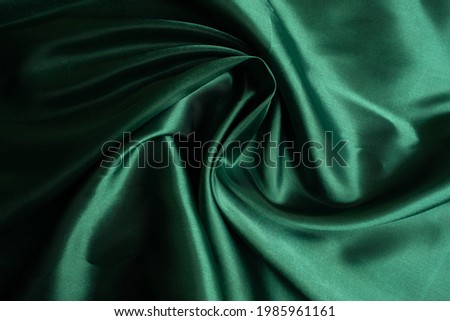 green fabric texture background, abstract, closeup texture of cloth
