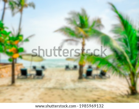 Beautiful beach with sky and palm trees. Blur picture