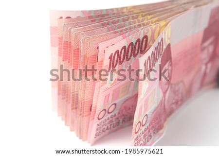 Photo Rupiah Paper Money, Close Up of 100000 at White Background