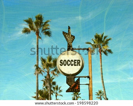  aged and worn vintage photo of soccer sign with palm trees                              