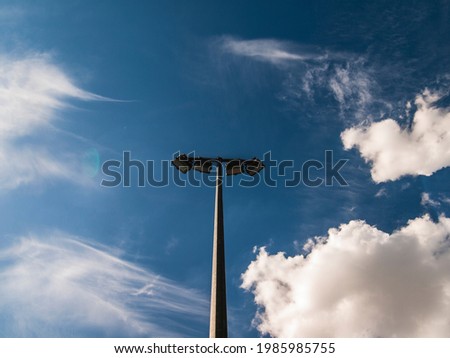 street lamp on the background of a blue sky with clouds