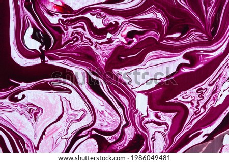 Magenta marble texture. Abstract acrylic pink and purple background. Fuchsia artistic fluid art. Beautiful lines of mixing colors of white, pink, crimson, lilac. The color of 2023 Viva Magenta