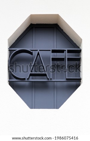 Art deco cafe sign on a wall