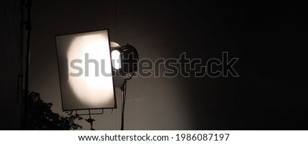 Studio light equipments for photo or film movie video. Light set for professional shooting and screen background. LED Flood light and Spot light for video production. Setup include Barn door softbox.